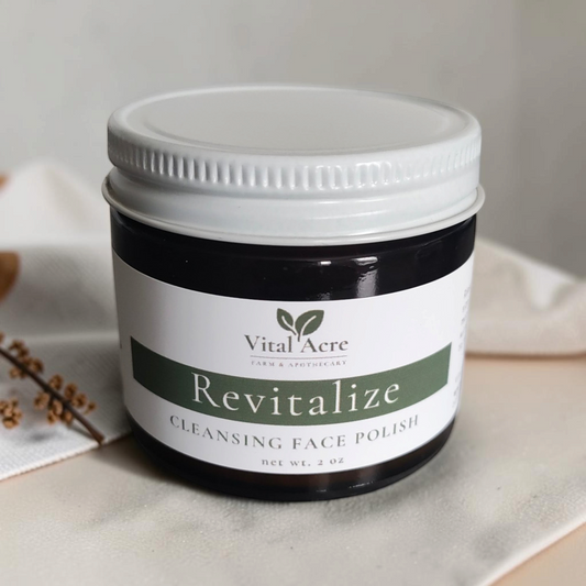 Vital Acre Farm & Apothecary Revitalize gentle exfoliating face polish in a dark amber glass jar with white lid.