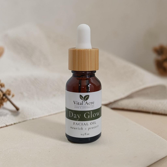Vital Acre Farm & Apothecary Day Glow serum in an amber glass dropper bottle with a wooden cap on a neutral surface.
