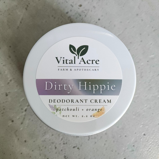 Vital Acre Farm & Apothecary Dirty Hippie natural deodorant cream in a white tin with patchouli and orange scent.