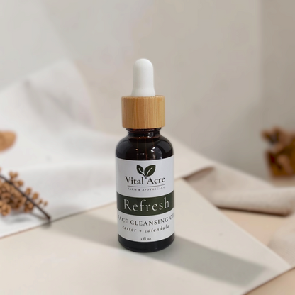 Vital Acre Farm & Apothecary Refresh face cleansing oil in an amber glass bottle with a bamboo dropper cap.