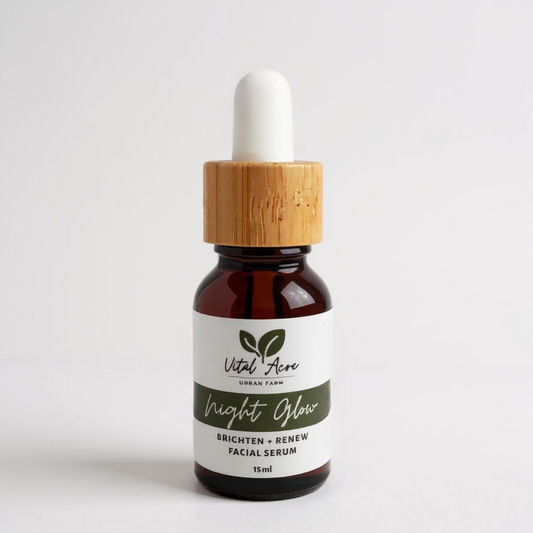 Facial serum bottle with wooden dropper on a white background