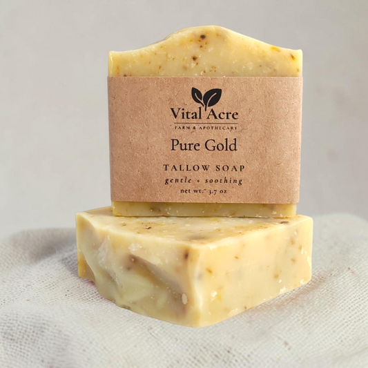 Vital Acre Farm & Apothecary Pure Gold tallow face soap bar with calendula petals on a white background