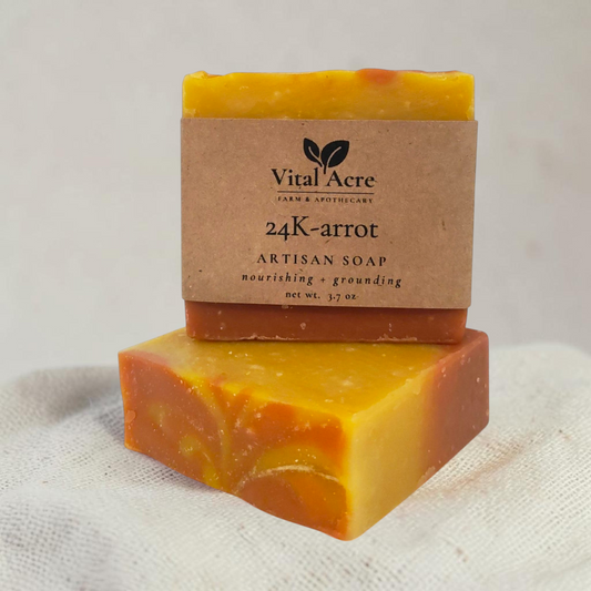 Vital Acre Farm & Apothecary 24K-arrot artisan soap bar with a marbled orange and yellow natural carrot juice base.