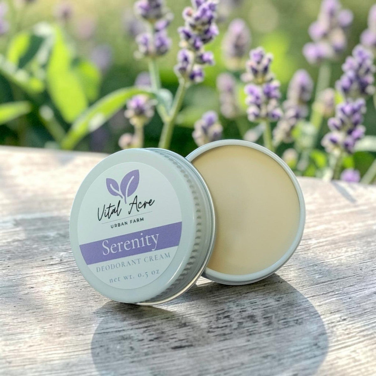 Vital Acre Farm & Apothecary Serenity tallow deodorant cream in a small metal tin on a wooden surface